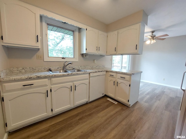 kitchen featuring dishwasher, sink, white cabinetry, kitchen peninsula, and ceiling fan