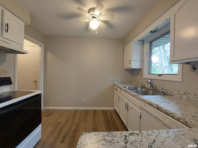 kitchen with white appliances, hardwood / wood-style floors, ceiling fan, and white cabinets