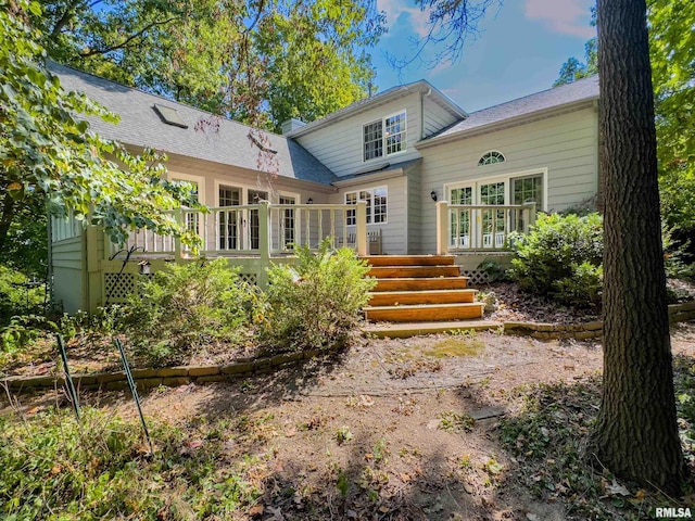 rear view of property with a deck