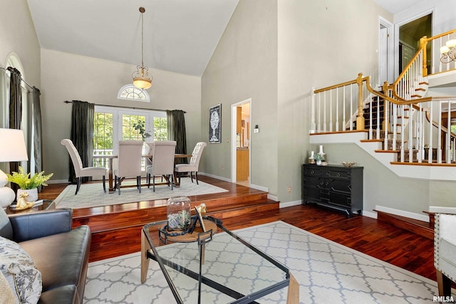 living room featuring hardwood / wood-style floors and high vaulted ceiling