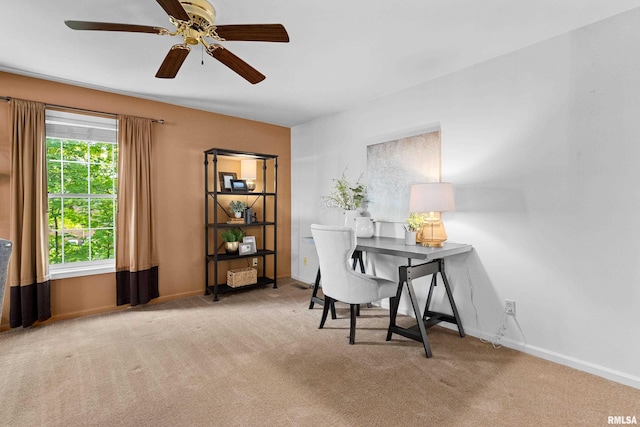 home office featuring ceiling fan and light colored carpet