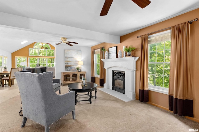 living room featuring ceiling fan, light colored carpet, lofted ceiling, and a wealth of natural light