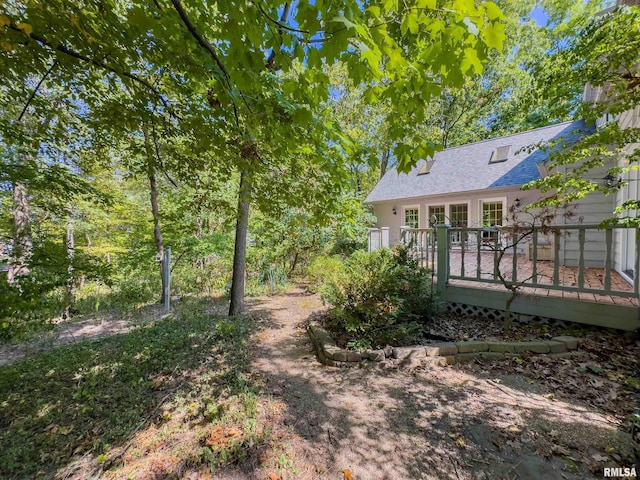 view of yard with a wooden deck