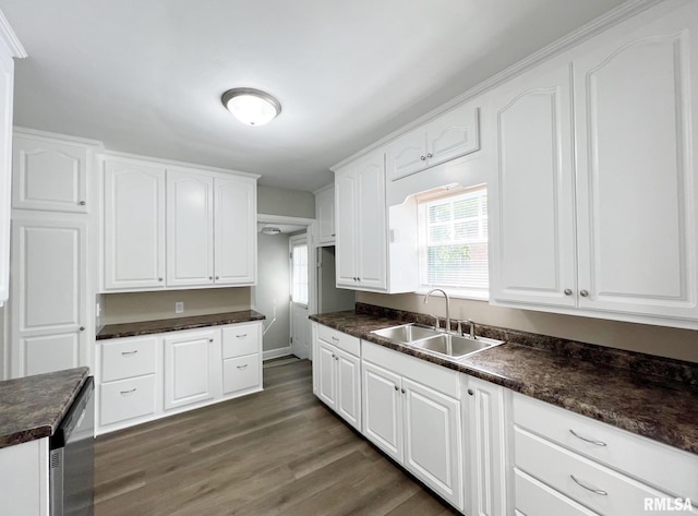 kitchen with white cabinets, dark hardwood / wood-style floors, and sink