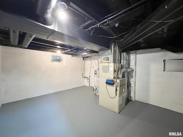 basement with water heater and heating unit