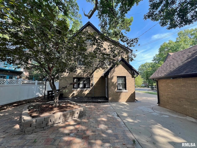 rear view of property featuring a patio