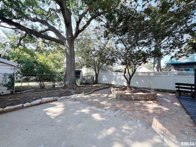 view of patio / terrace featuring an outdoor fire pit