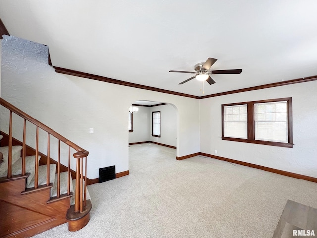 interior space featuring crown molding and ceiling fan