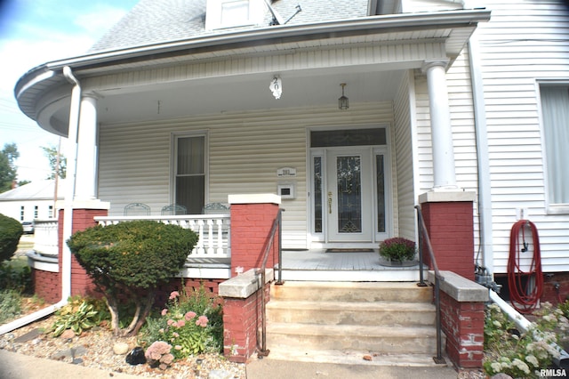 doorway to property featuring covered porch