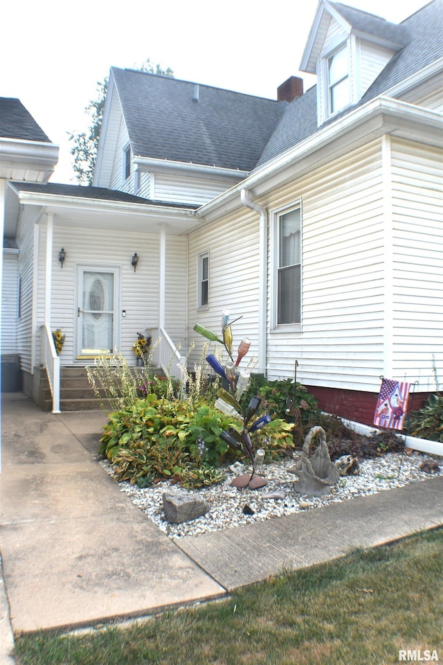 view of property exterior featuring a porch