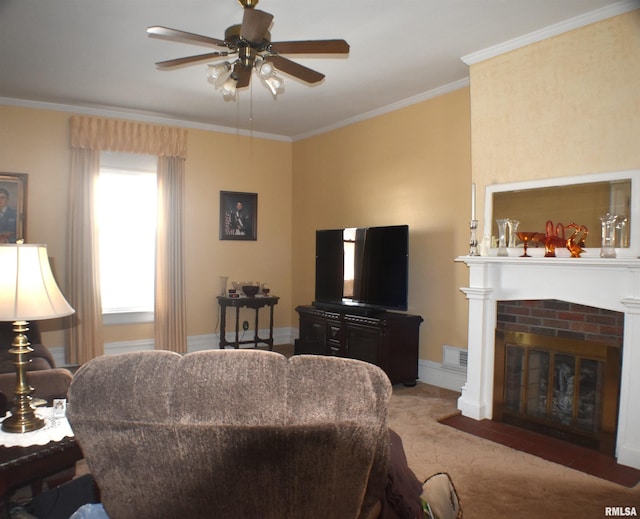 living room with ornamental molding, ceiling fan, light colored carpet, and a brick fireplace