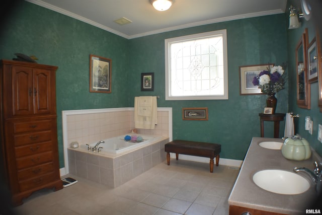 bathroom with tiled tub, ornamental molding, sink, and tile patterned flooring