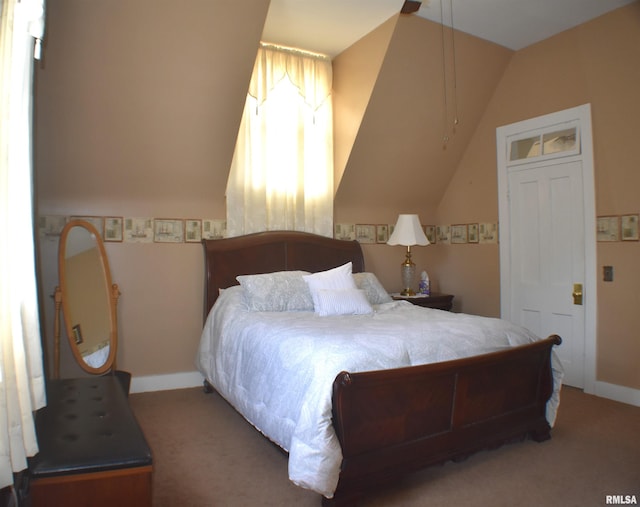 carpeted bedroom with vaulted ceiling