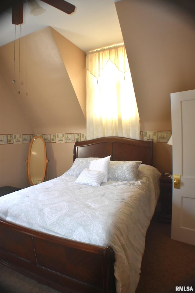 carpeted bedroom featuring lofted ceiling and ceiling fan