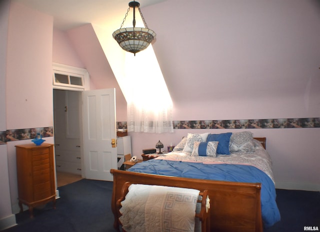 carpeted bedroom with lofted ceiling