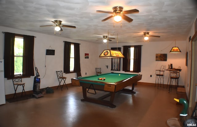 rec room featuring concrete floors, ceiling fan, and billiards