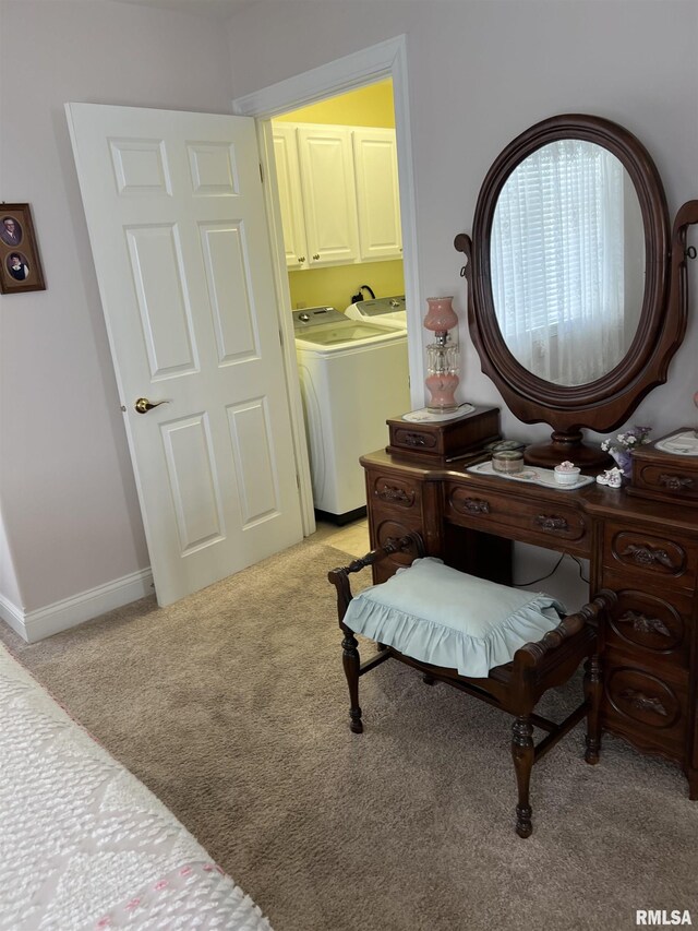 carpeted bedroom with separate washer and dryer and ensuite bath