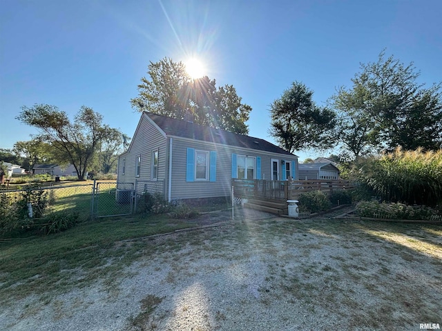 rear view of property with a lawn