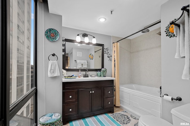 full bathroom featuring vanity, toilet, and shower / bath combo with shower curtain