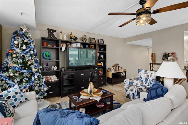 tiled living room with a textured ceiling and ceiling fan