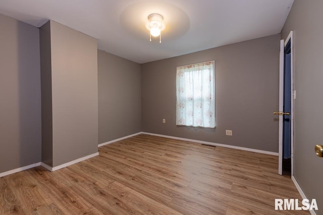 unfurnished room featuring ceiling fan and light hardwood / wood-style floors