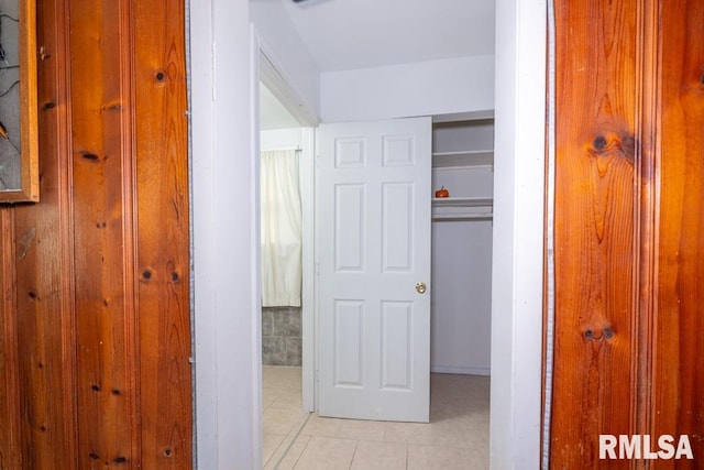 hall with light tile patterned flooring