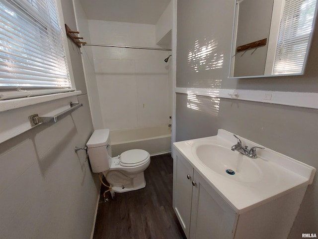 full bathroom with vanity, hardwood / wood-style floors, toilet, and bathtub / shower combination