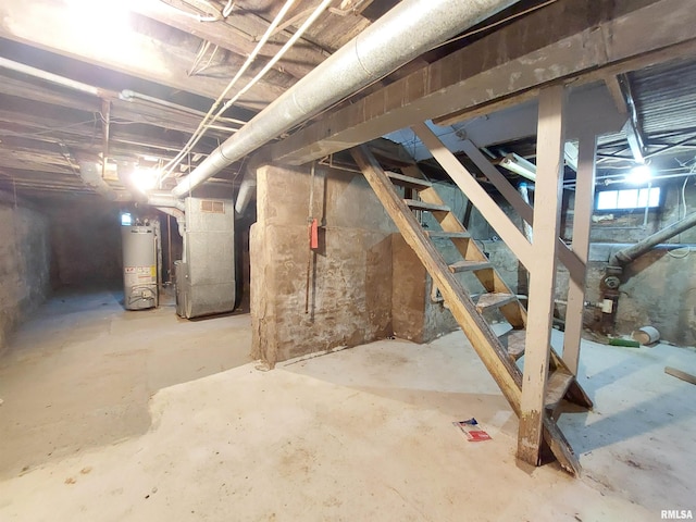 basement featuring water heater and heating unit