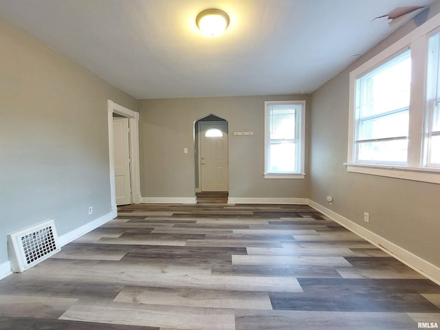 spare room featuring dark hardwood / wood-style floors