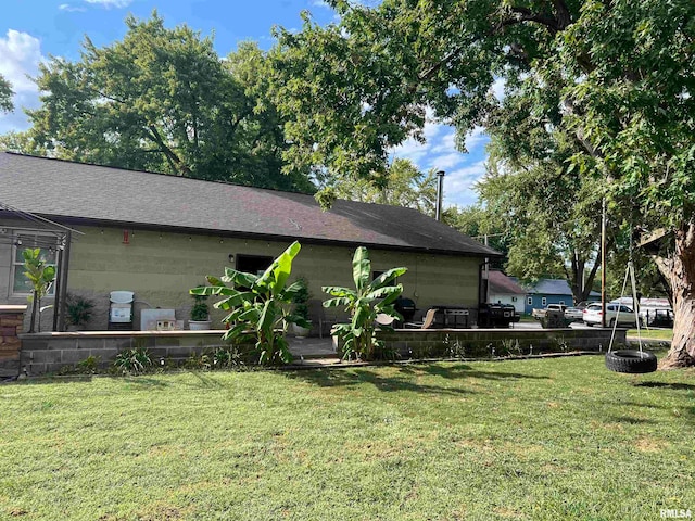 view of home's exterior featuring a yard