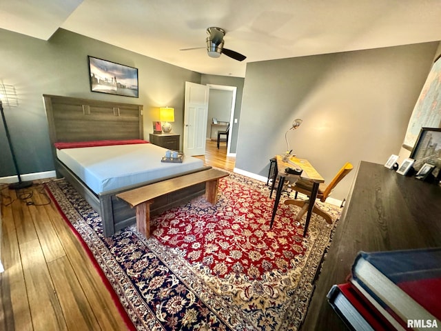 bedroom with ceiling fan and hardwood / wood-style floors