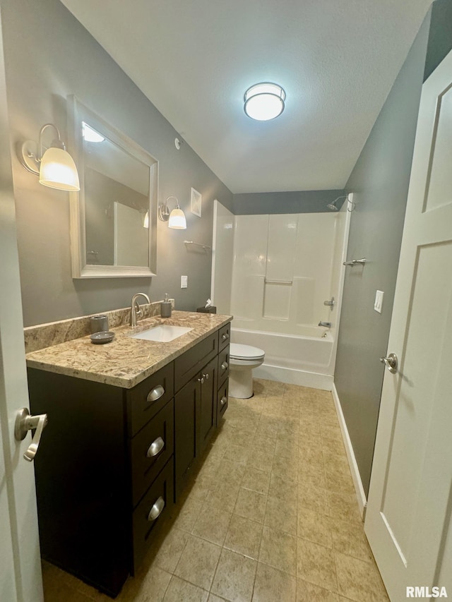 full bathroom featuring vanity, tile patterned flooring, toilet, and washtub / shower combination