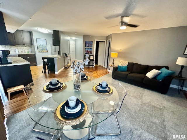 dining room featuring light wood-type flooring and ceiling fan