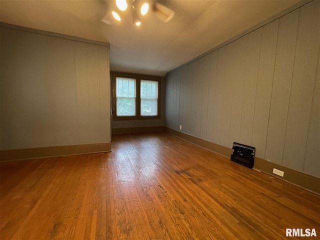 stairs with crown molding and hardwood / wood-style floors