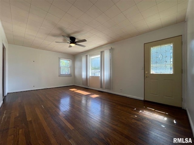 foyer with ceiling fan and dark hardwood / wood-style flooring