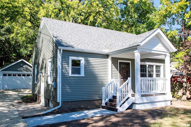 view of front of home with an outbuilding and a garage