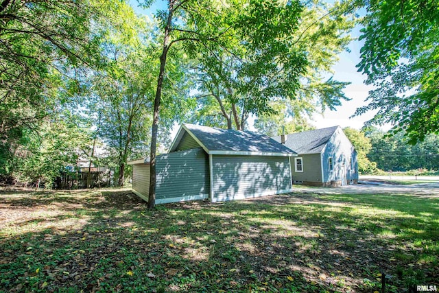 view of outdoor structure with a lawn