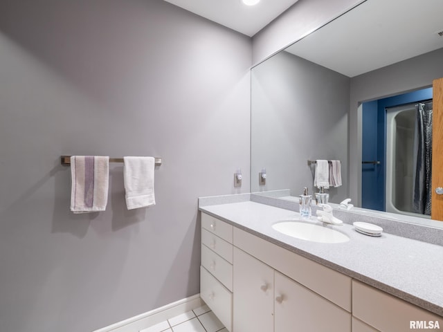 bathroom featuring tile patterned floors and vanity