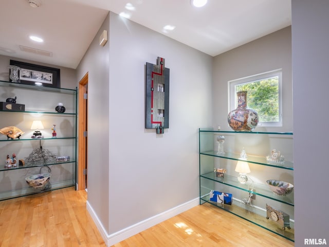 corridor featuring hardwood / wood-style flooring