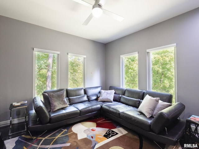 living room featuring ceiling fan and plenty of natural light