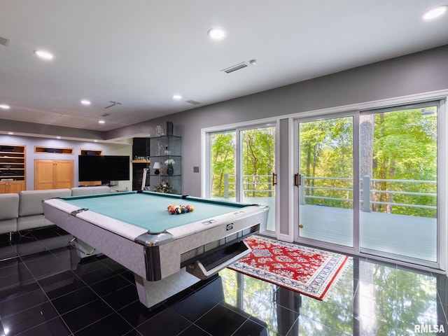 playroom with pool table, dark tile patterned flooring, and a healthy amount of sunlight