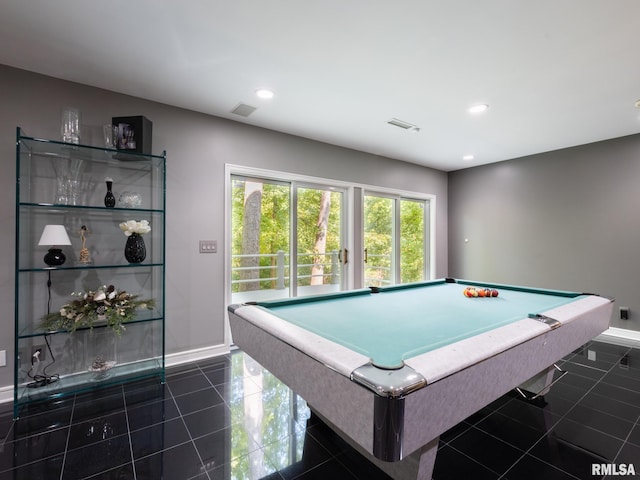 rec room with pool table and dark tile patterned floors