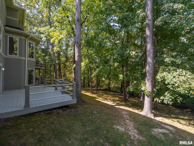 view of yard featuring a wooden deck