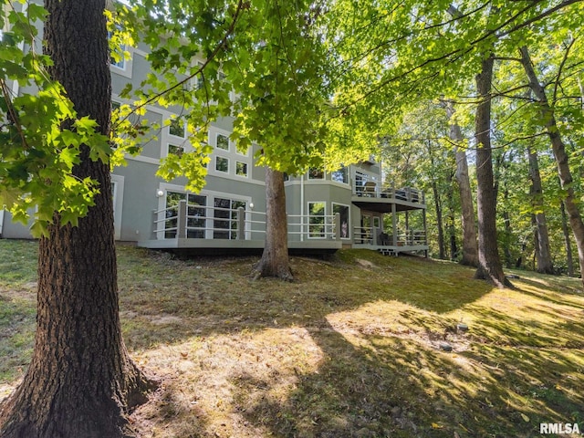 back of property featuring a wooden deck