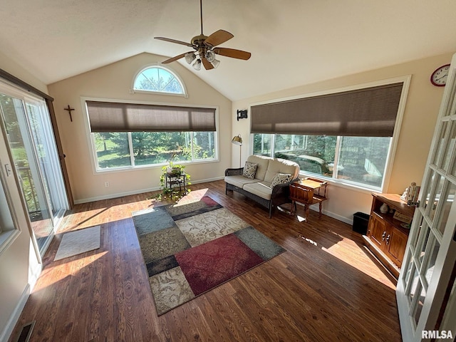 living room featuring lofted ceiling, ceiling fan, and dark hardwood / wood-style floors