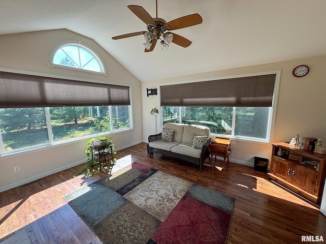 living room featuring ceiling fan, vaulted ceiling, and dark hardwood / wood-style flooring