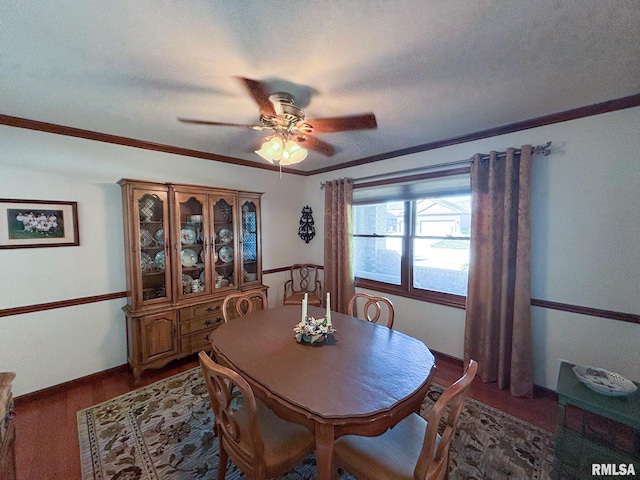 dining area with ceiling fan, a textured ceiling, and crown molding