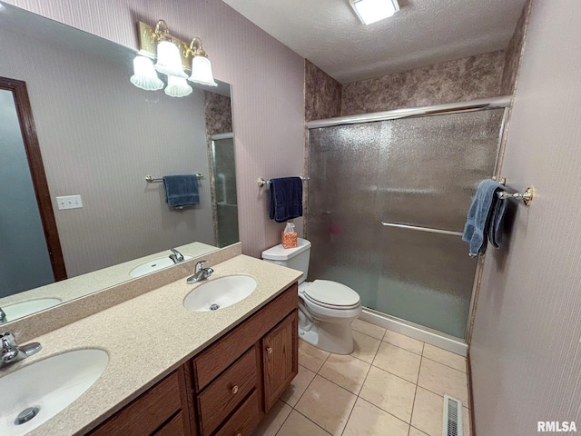 bathroom featuring walk in shower, vanity, and toilet