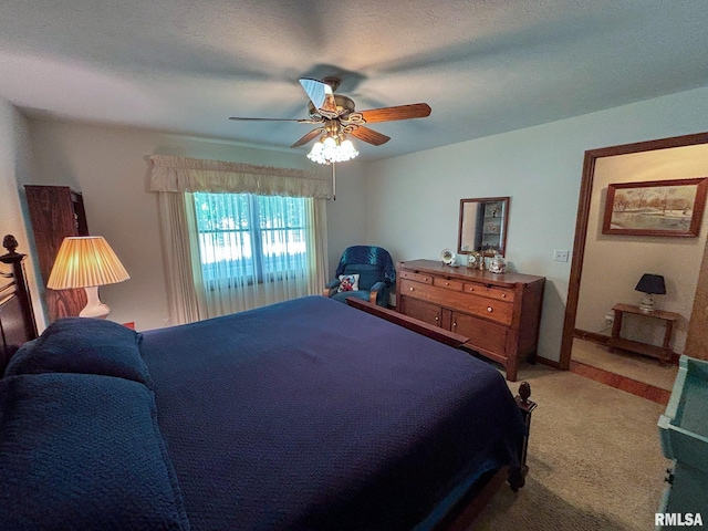 bedroom with ceiling fan and carpet floors