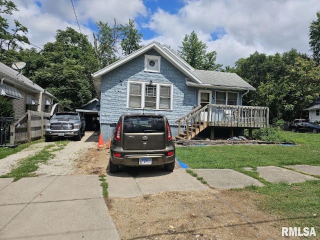 bungalow-style home featuring a front yard